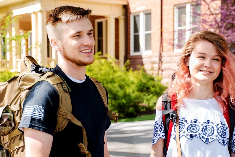 students talking on campus